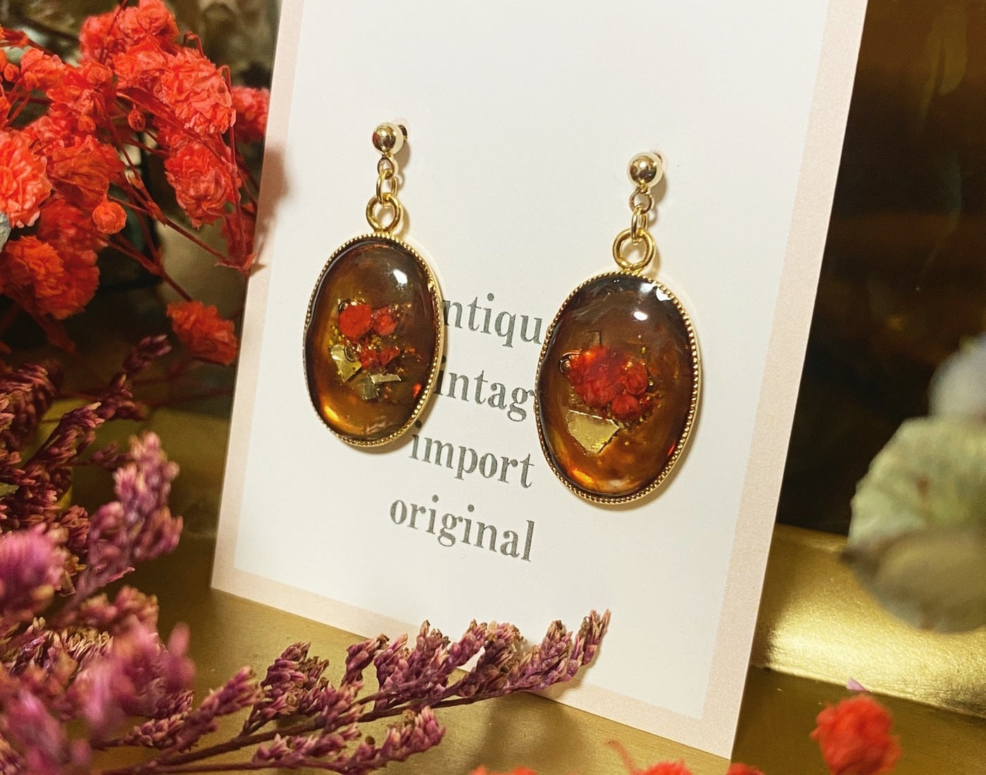red flower gold resin pierced earrings